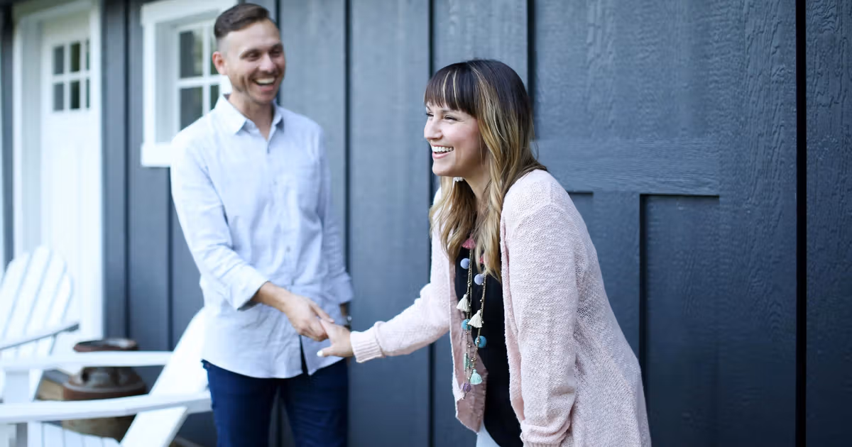 Homeowner shaking hands with a cash buyer after reviewing a no-obligation cash offer