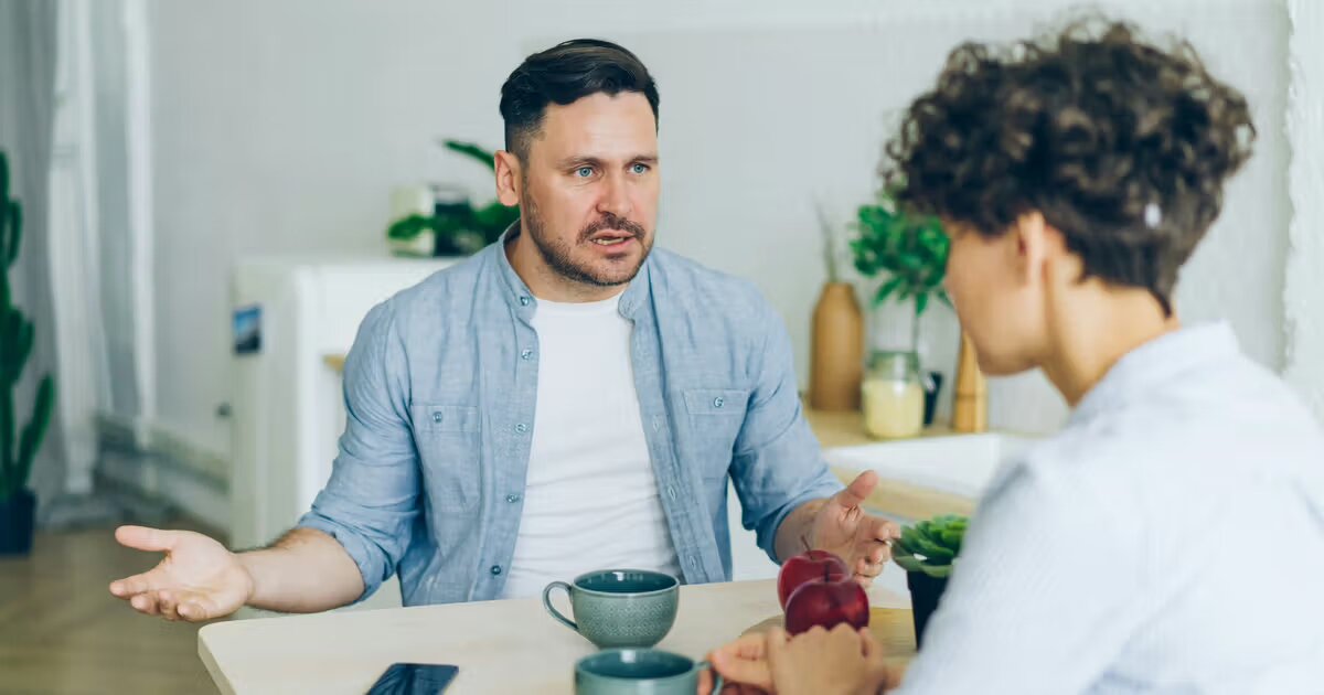 Couple meeting with an attorney to discuss selling their home during a divorce