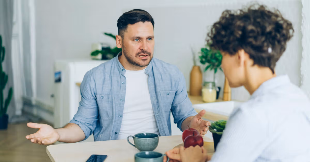 Couple meeting with an attorney to discuss selling their home during a divorce